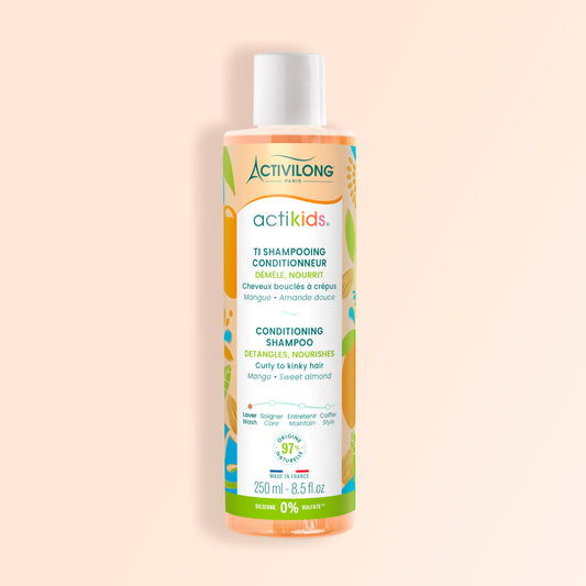 ACTIVILONG ACTIKIDS Ti-Shampooing Conditionneur 250ml bottle by ABS France Wholesale on a beige background