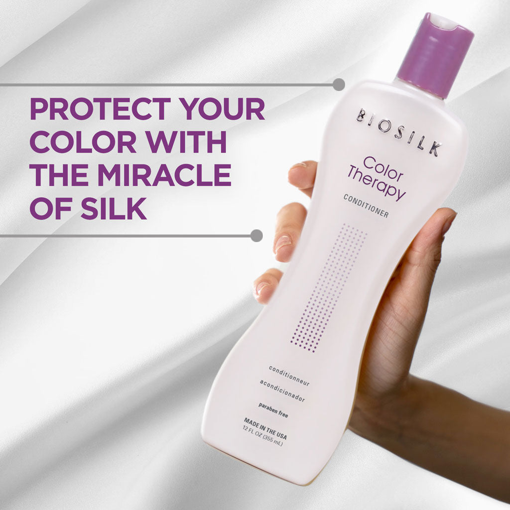 Biosilk Color Therapy conditioner bottle held by a hand with promotional text on a white background
