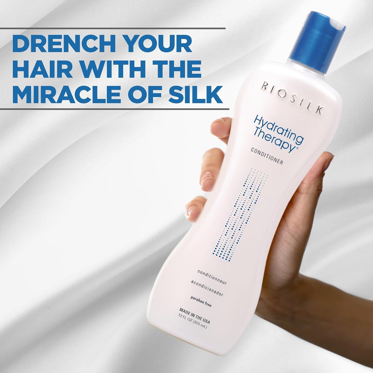 Biosilk Hydrating Therapy conditioner bottle held by a hand with promotional text on a white background