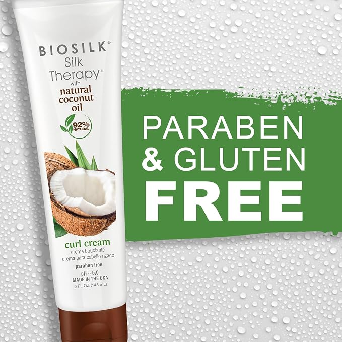 Biosilk Silk Therapy curl cream tube shown next to a green promotional banner that reads 'PARABEN & GLUTEN FREE' on a white background with water droplets.
