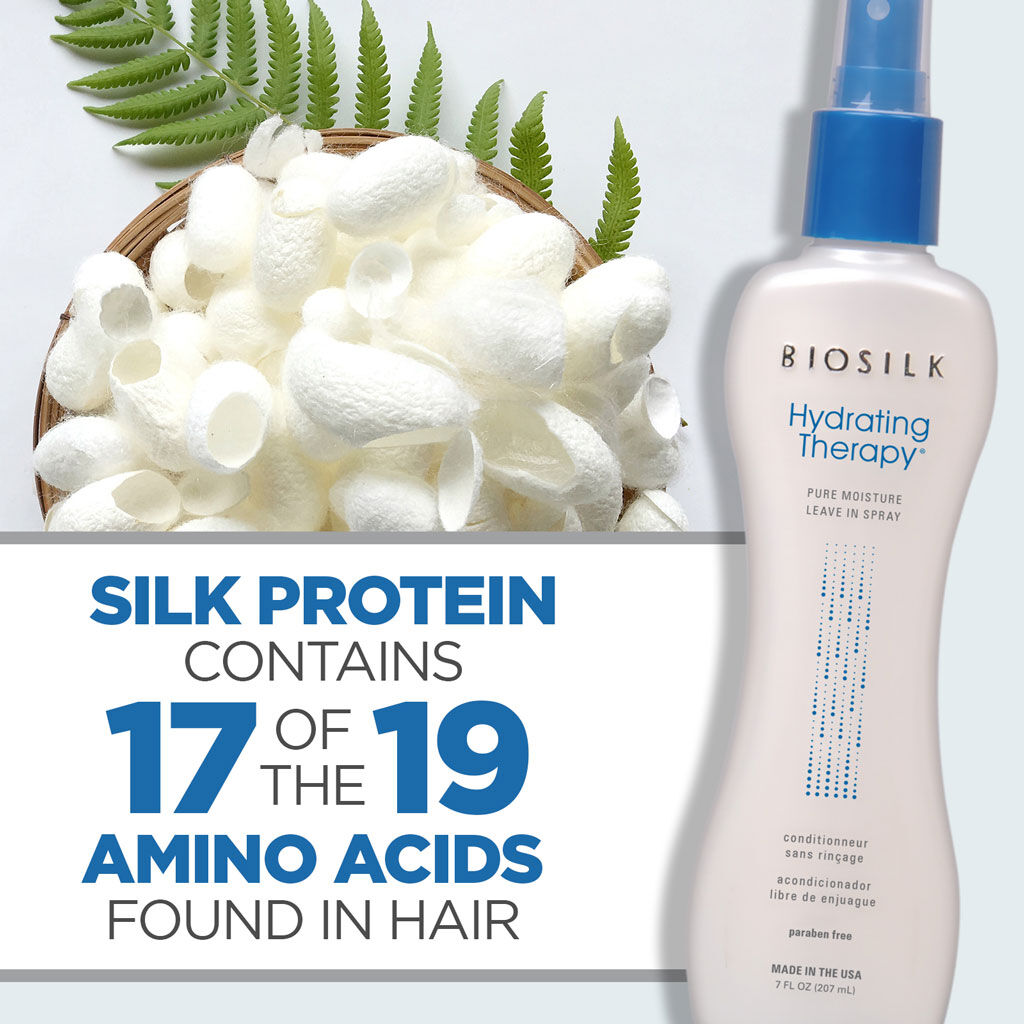 Biosilk Hydrating Therapy Pure Moisture Leave-In Spray bottle shown next to a basket of white silk protein flakes with green leaves, with text overlay 'SILK PROTEIN CONTAINS 17 OF THE 19 AMINO ACIDS FOUND IN HAIR'.