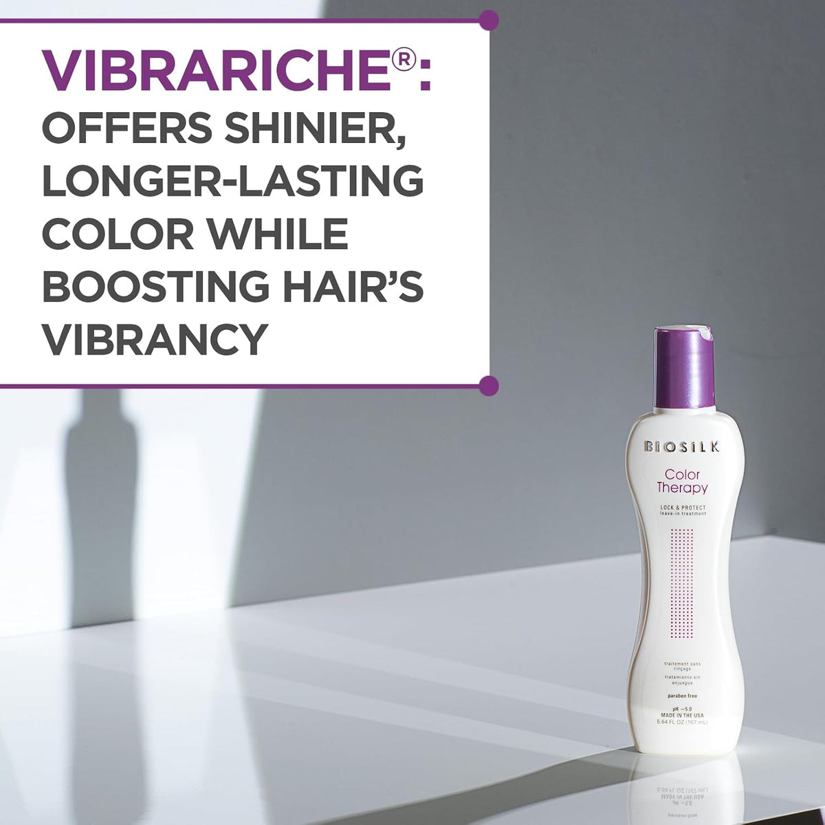 Biosilk Color Therapy bottle with promotional text about Vibrariche on a gray background