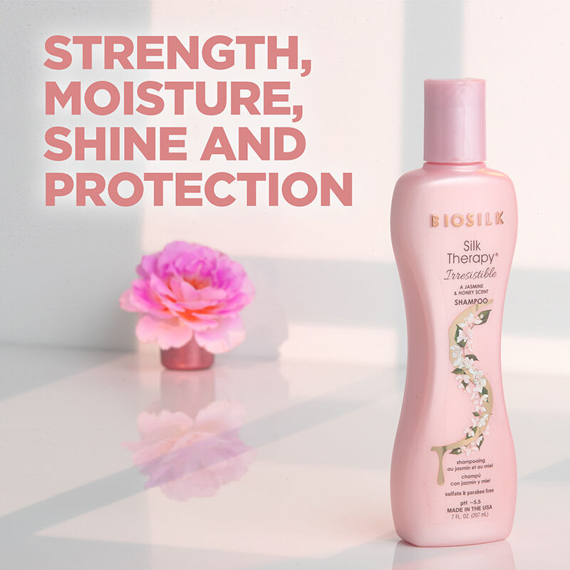 BioSilk Silk Therapy Shampoo bottle with pink flower on a light background