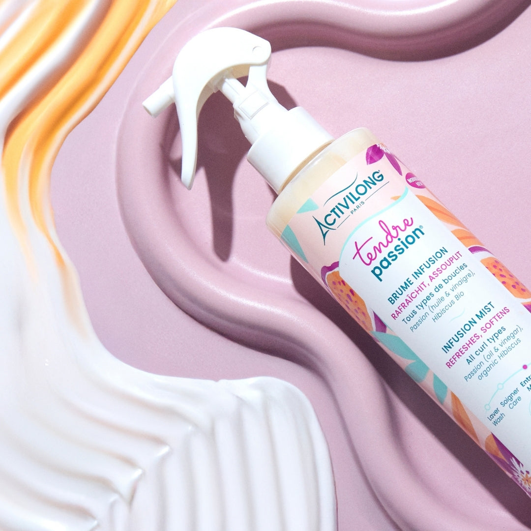 ACTIVILONG TENDRE PASSION Brume Infusion 250ml spray bottle by ABS France Wholesale on a pink and orange abstract background