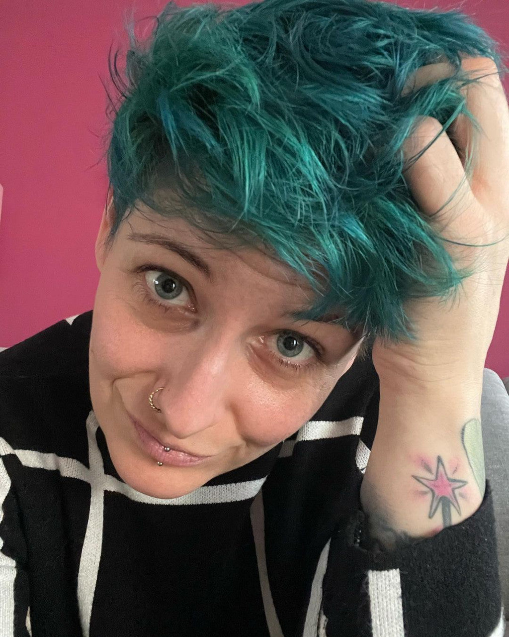 Crazy Colors' Person with teal hair against a pink background by ABS France Wholesale