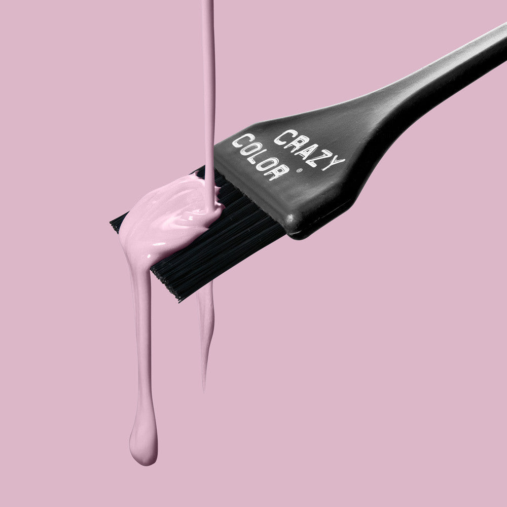 Hair color brush with Crazy Color Marshmallow 64 dye on a pink background, featuring the brand 'Crazy Color' by ABS France Wholesale