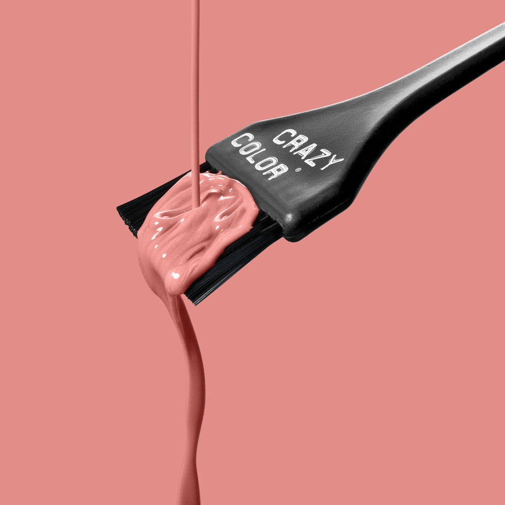 Crazy Color Rose Gold 73 hair color being applied with a 'Crazy Color' brush on a pink background by ABS France Wholesale