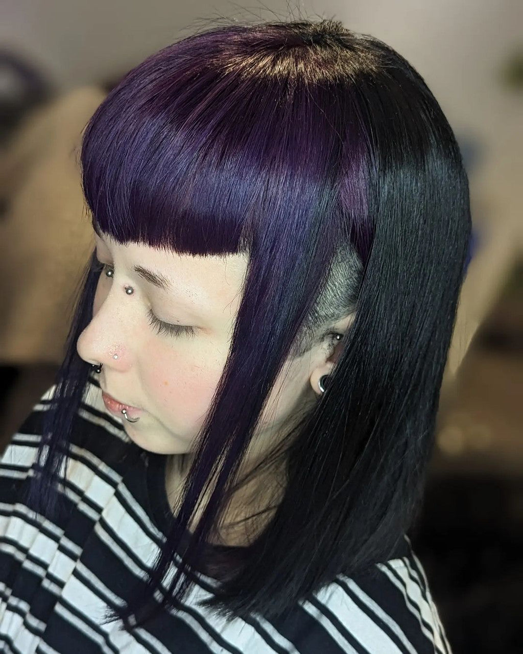 Crazy Color's Person with black hair and a purple streak, wearing a striped shirt by ABS France Wholesale