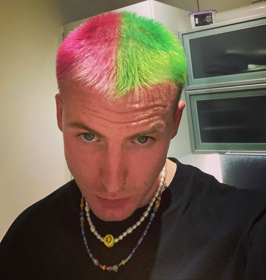 Crazy Color's Person with a colorful hairstyle in a kitchen setting by ABS France Wholesale