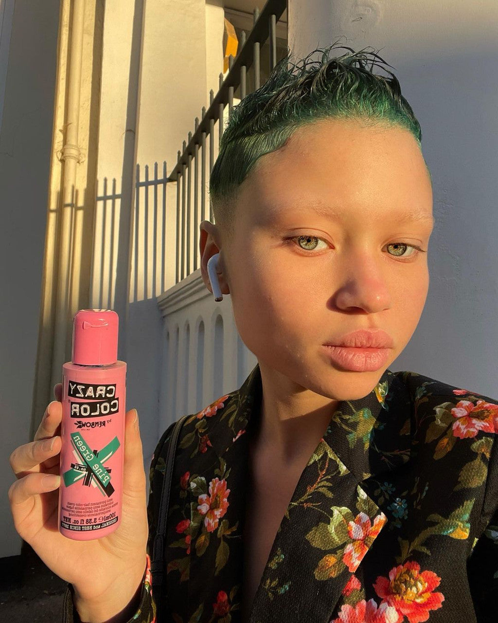 Person with Green Hairs holding Crazy Color Pine green Hair Dye product by ABS France Wholesale