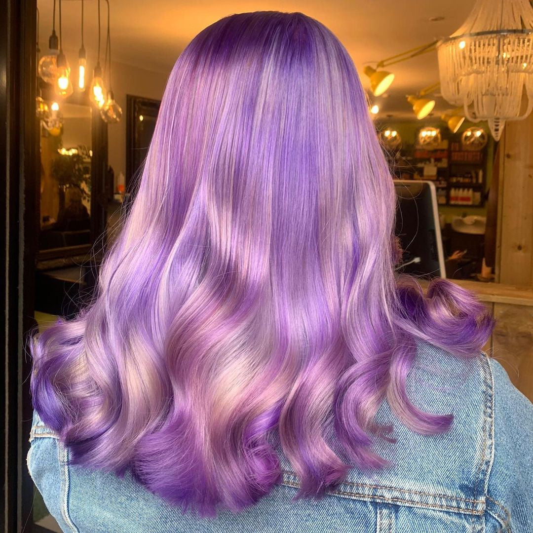 Crazy Color's Person with purple hair in a salon setting by ABS France Wholesale