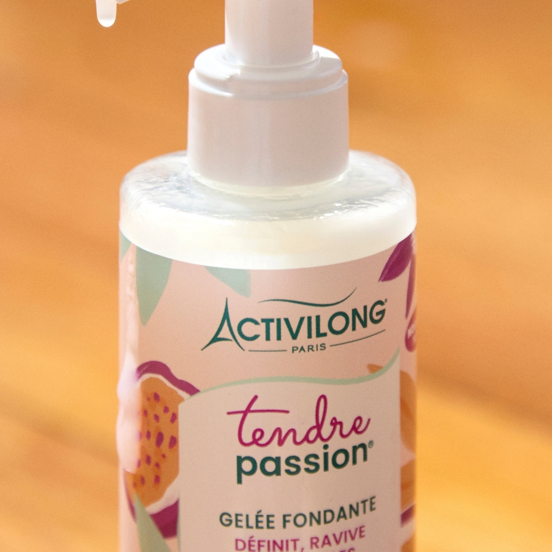 Bottle of ACTIVILONG TENDRE PASSION Gelée Fondante 260ml by ABS France Wholesale on a warm orange background