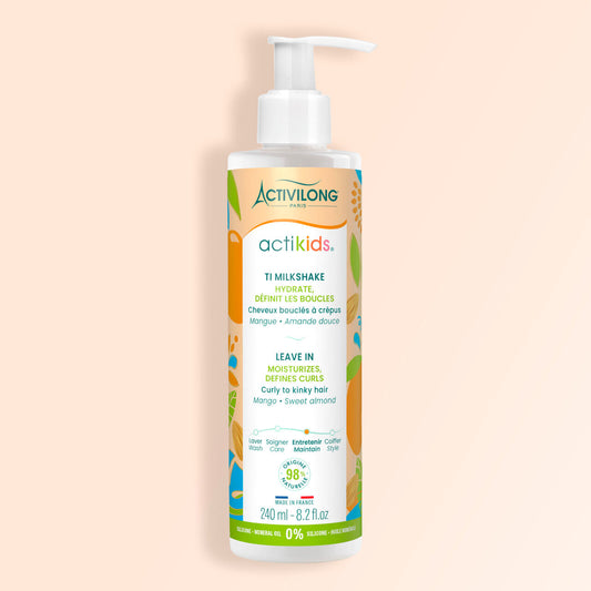 Bottle of Activilong Actikids Ti Milkshake hair care product by ABS France Wholesale on a beige background