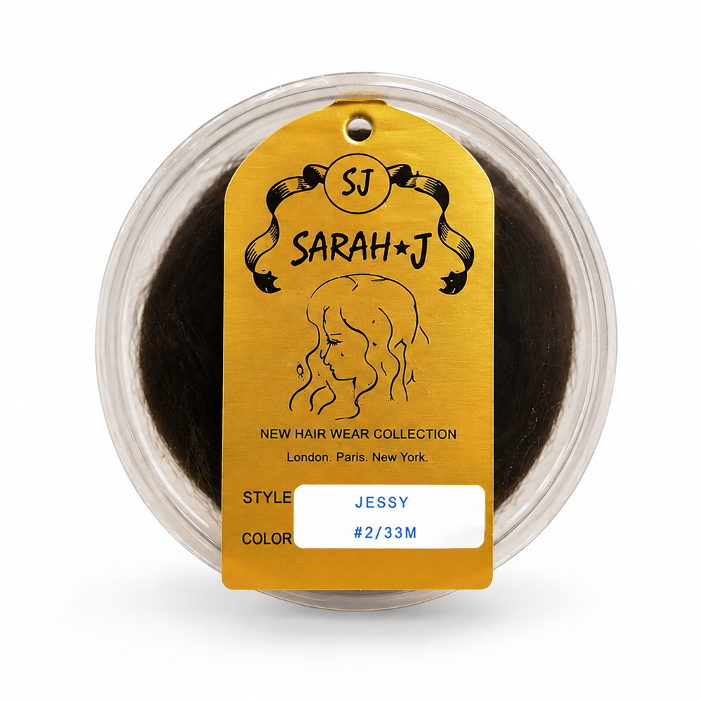 A packaged hair extension product in a clear round container with a gold tag reading 'SJ SARAH+J' and 'JESSY #2/33M'. The visible hair is very dark brown, and the background is plain white.