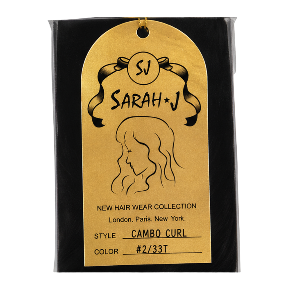 A black retail package containing a gold arched hangtag for a hair product. The tag reads 'SJ SARAH+J', 'NEW HAIR WEAR COLLECTION', 'Style CAMBO CURL', and 'Color #2/33T', with a line drawing of a woman's hair profile.