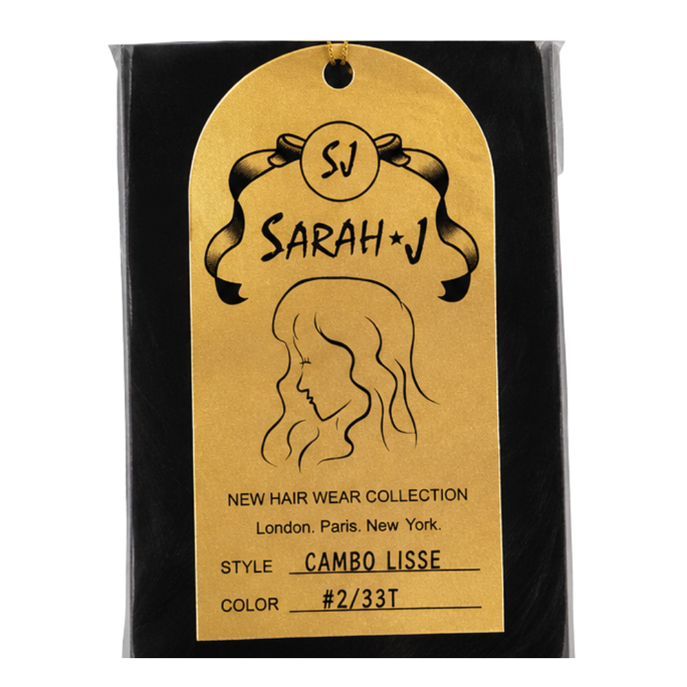 A gold-colored arched hangtag from Sarah + J Hairwear Collection, detailing the 'Cambo Lisse' style and color code #2/33T, attached to a black wig.