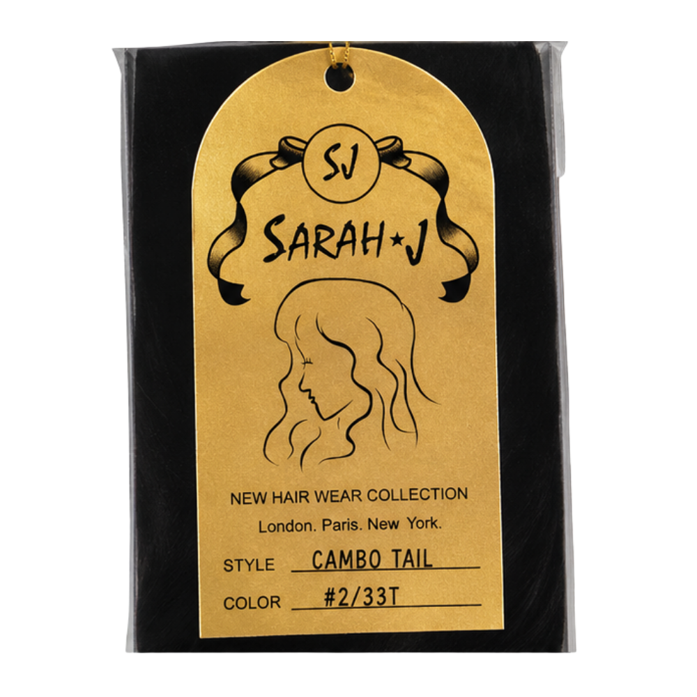 A gold-colored hangtag with black printed text and a line drawing of a woman's hair, attached to a black backing card. The tag reads 'SJ SARAH*J', 'NEW HAIR WEAR COLLECTION', 'Style CAMBO TAIL', and 'COLOR #2/33T'.