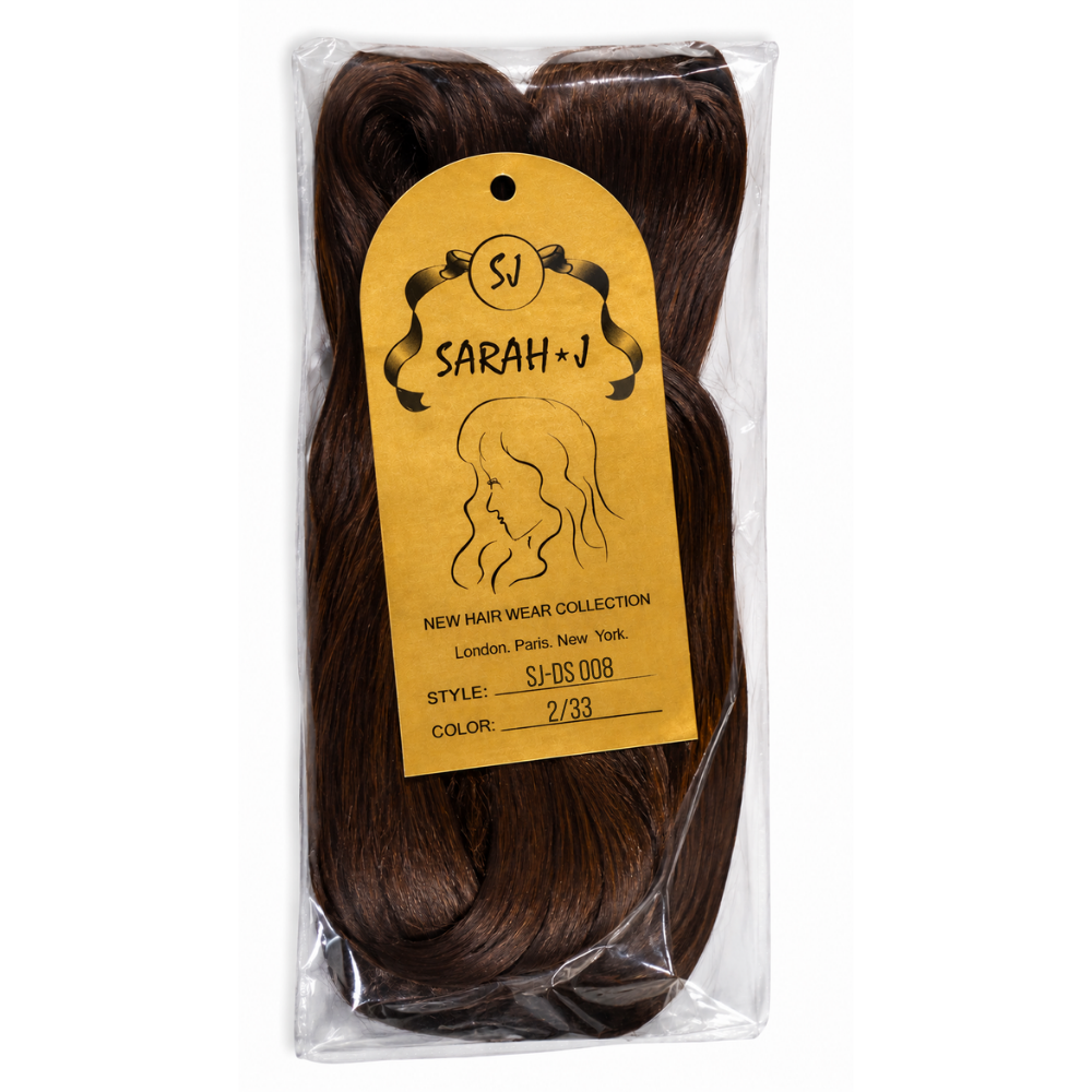 A packaged dark brown hair extension bundle in a clear plastic bag with a large yellow tag reading SARAH+J.
