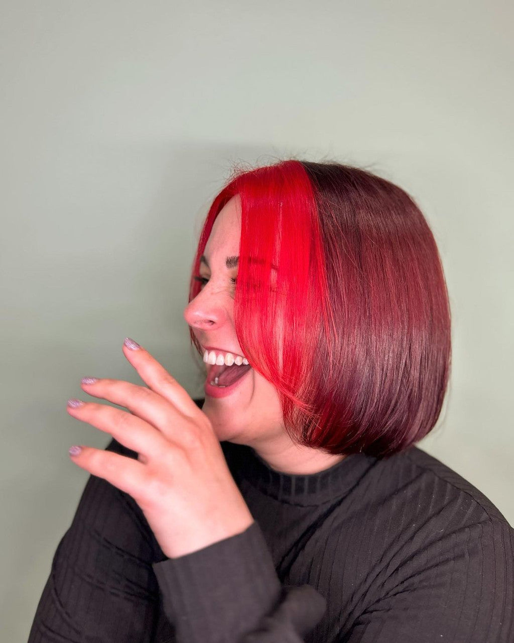 Person with a unique hairstyle featuring red and brown hair against a plain background - ABS France Wholesale