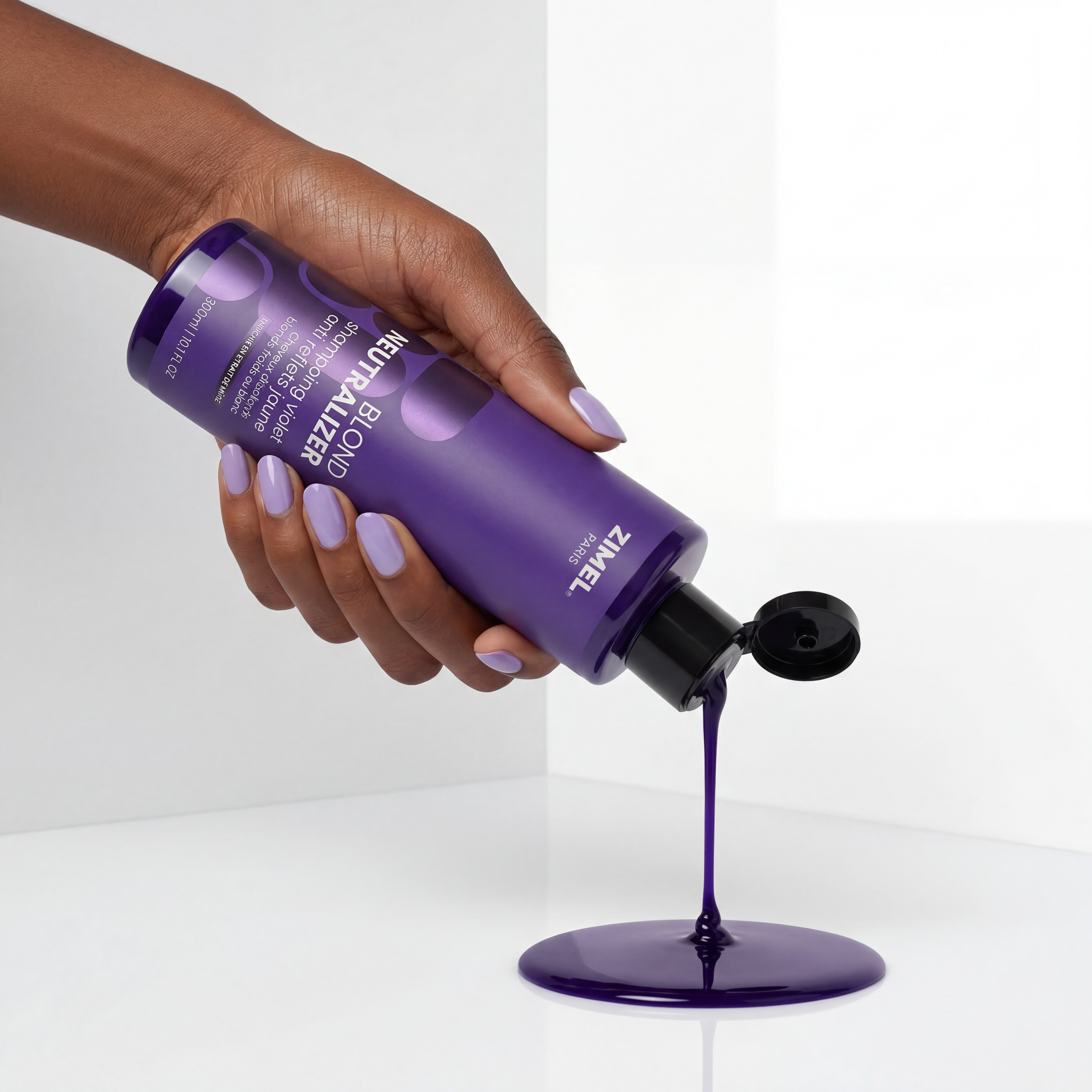 Hand holding a Zimel Paris BLOND NEUTRALIZER Shampoing Violet Anti Reflets Jaune 300ml bottle by ABS France Wholesale, pouring its contents onto a white surface.