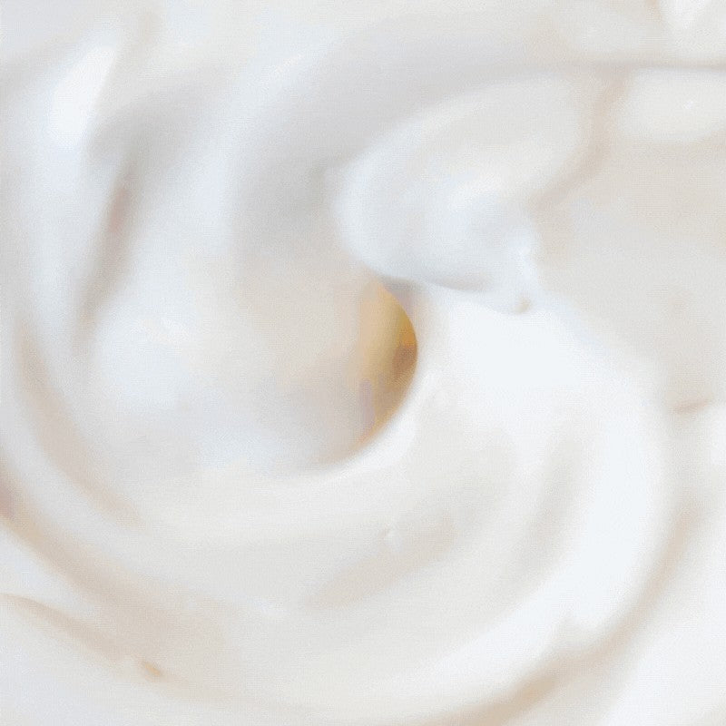 Close-up of a smooth, white surface with soft concentric circles.