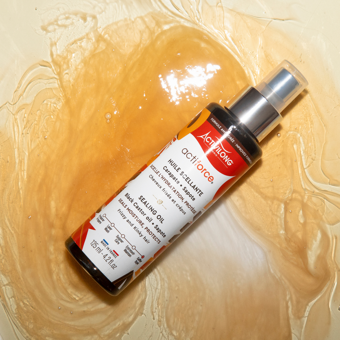 ACTIVILONG ACTIFORCE Huile Scellante 125ml bottle by ABS France Wholesale on a textured beige background