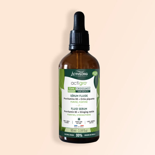 Bottle of ACTIVILONG ACTIGRO Sérum Fluide 90ml by ABS France Wholesale on a beige background