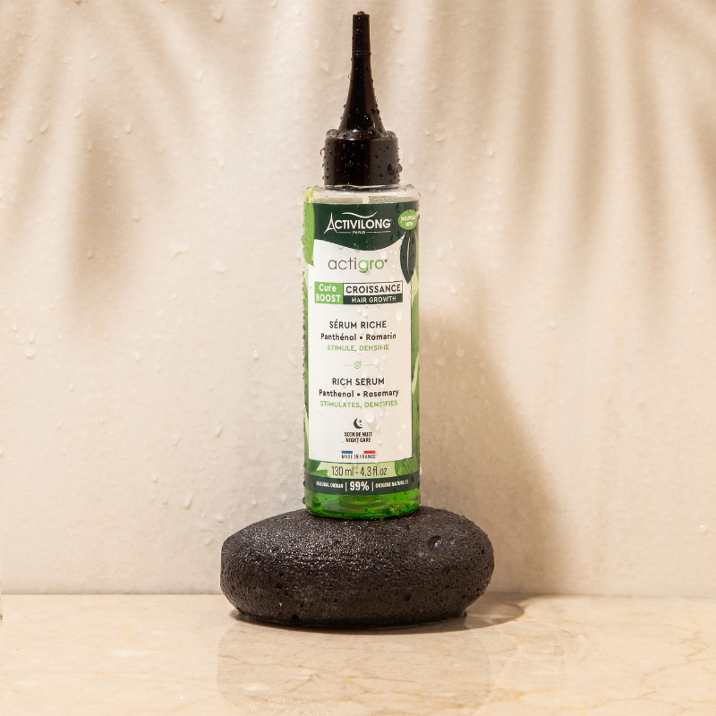 ACTIVILONG ACTIGRO Sérum Riche 130 ml bottle by ABS France Wholesale on a stone surface with a neutral background
