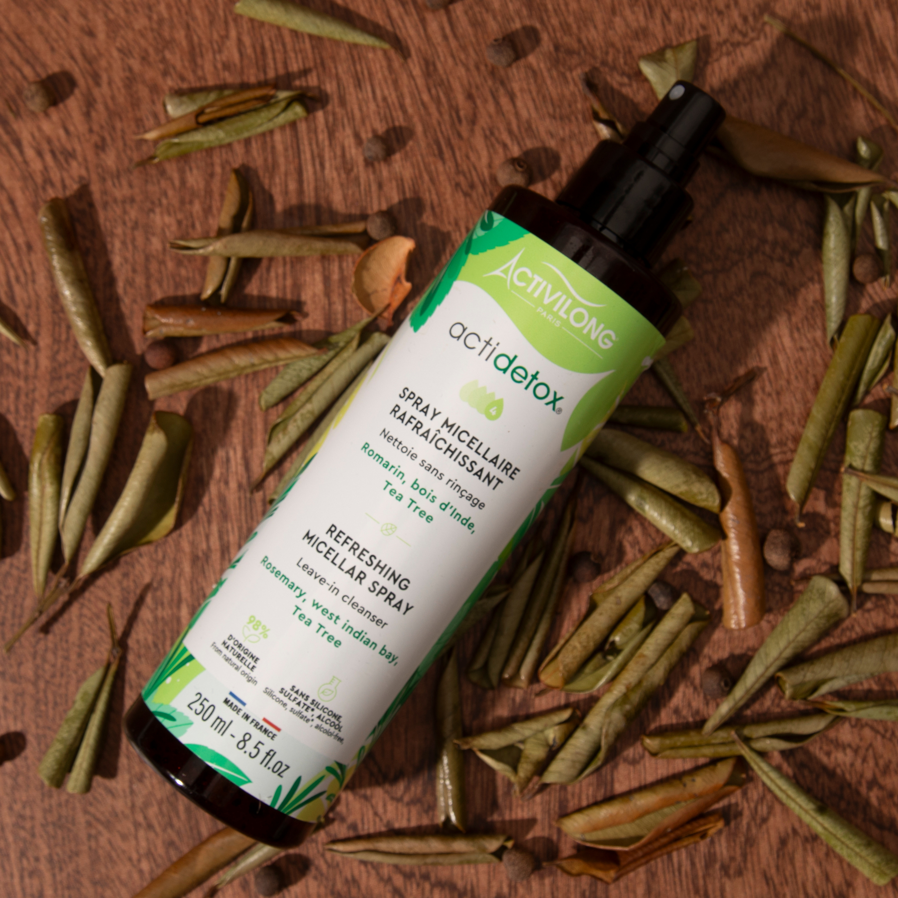 ACTIVILONG ACTIDETOX Spray Micellaire Rafraîchissant 250ml bottle by ABS France Wholesale on a wooden surface with dried herbs.